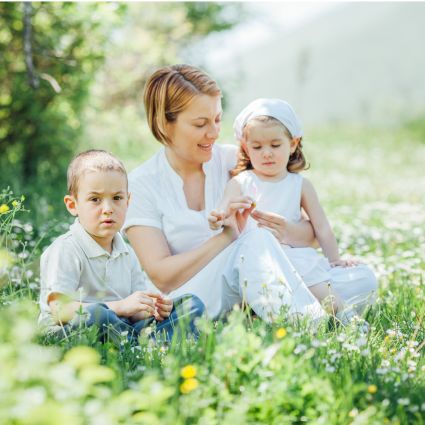 Parent sits with child outside